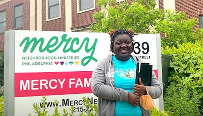 Mariya Saunders stands in front of Mercy Neighborhood Ministries.