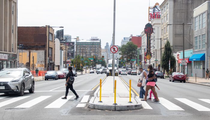 pedestrians cross new median on North Broad Street