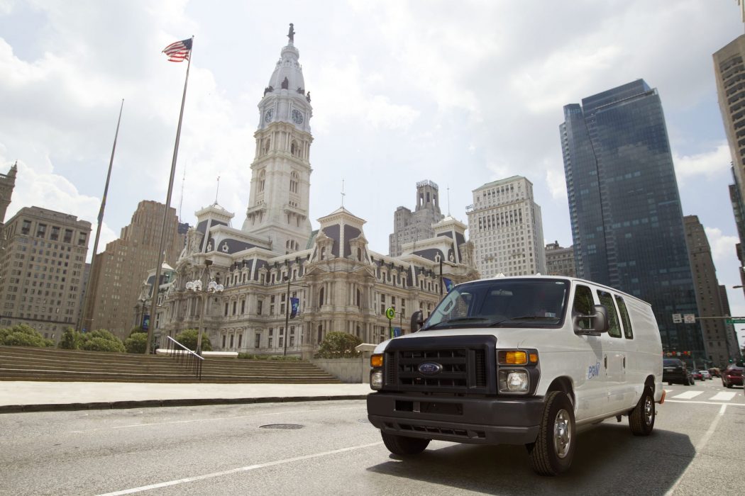 White service van in front of Philadelphia City Hall