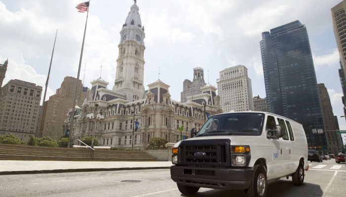 White service van in front of Philadelphia City Hall