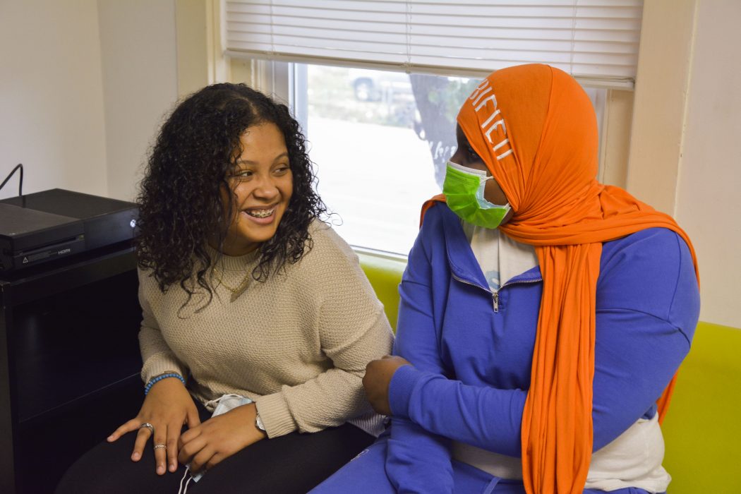 High school sophomore Aurealis laughs with a friend.