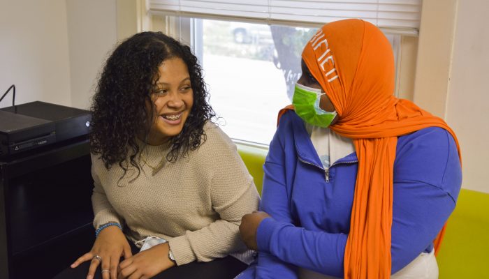 High school sophomore Aurealis laughs with a friend.