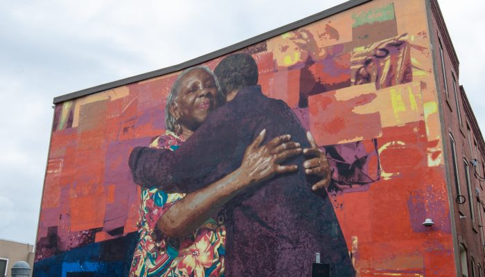 mural of two people hugging