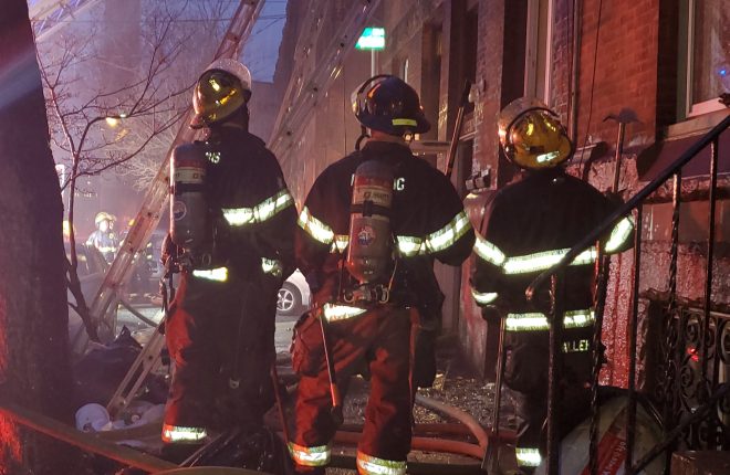 philadelphia fire department firefighters looking at the firefighting operation