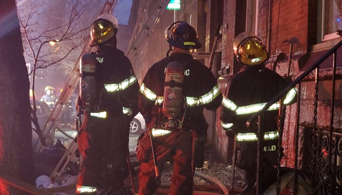 philadelphia fire department firefighters looking at the firefighting operation