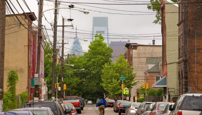 A person biking through a Philadelphia neighborhood