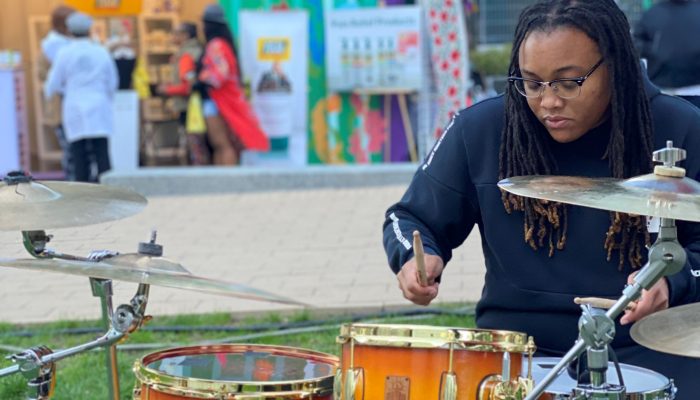 A drummer playing live at LOVE Park.
