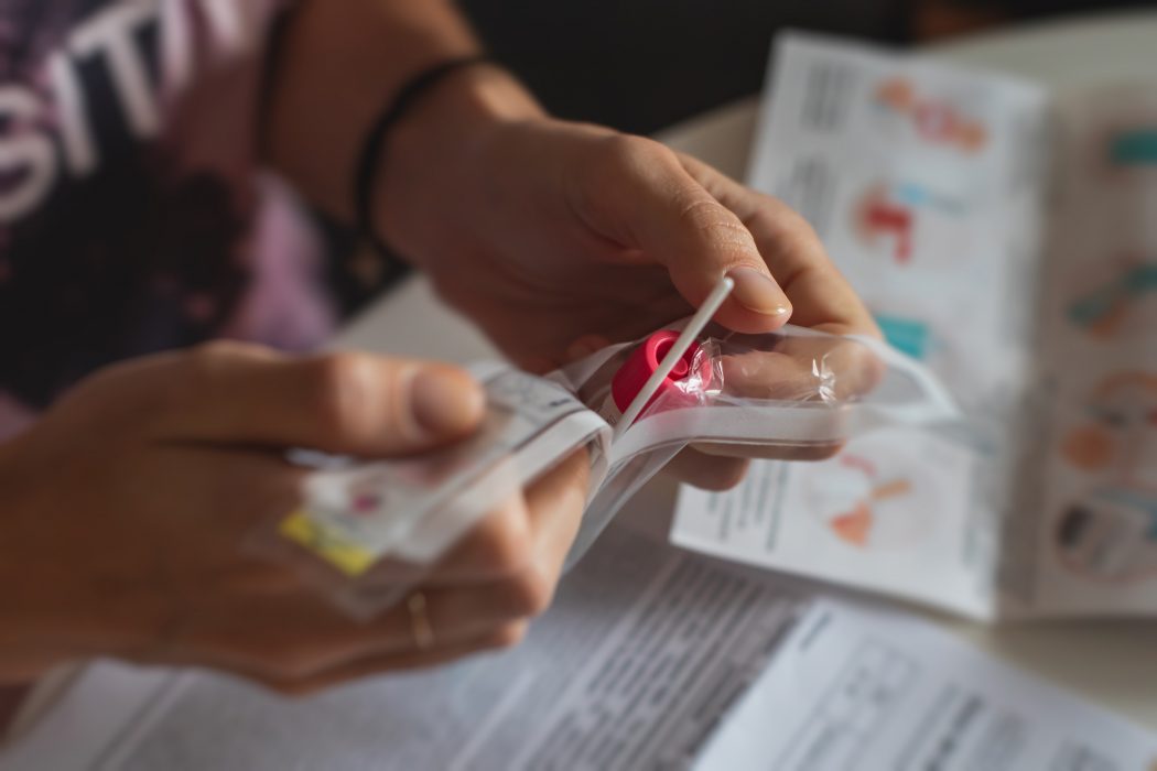 Person opening an at-home COVID test
