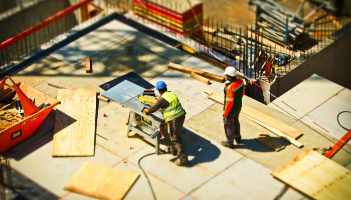 two workers on construction site