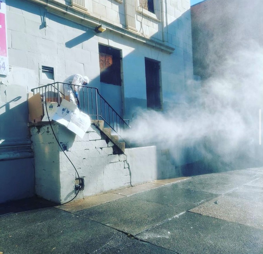 Matt Fitzpatrick conducting a Bio-Cleanup; power washing the northeast corner of Kensington Ave and Huntingdon Street 