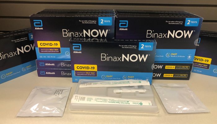 BinaxNow COVID-19 test kits stacked on a table