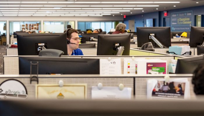 a customer service representative wearing a headset in Water's customer contact center