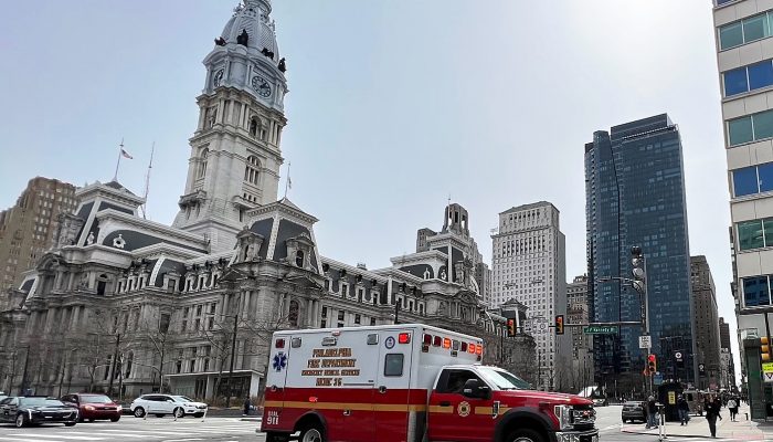philadelphia fire department ambulance driving by city hall
