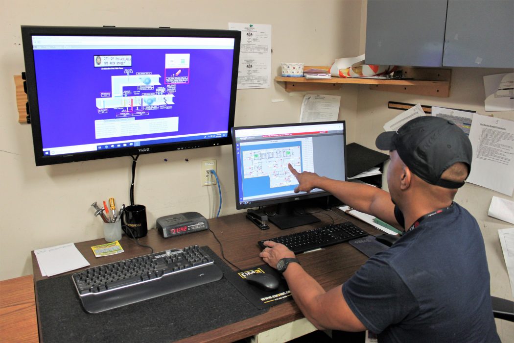 Building engineer Miguel Colon looks at a building automation system