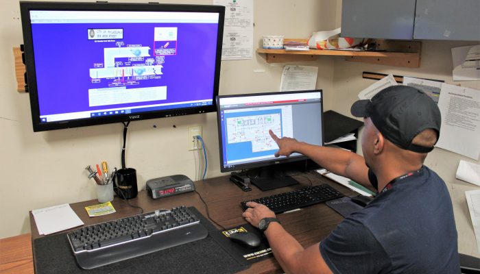 Building engineer Miguel Colon looks at a building automation system