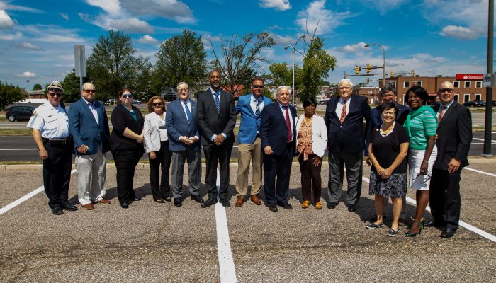 City, state and advocacy leaders pose for a photo