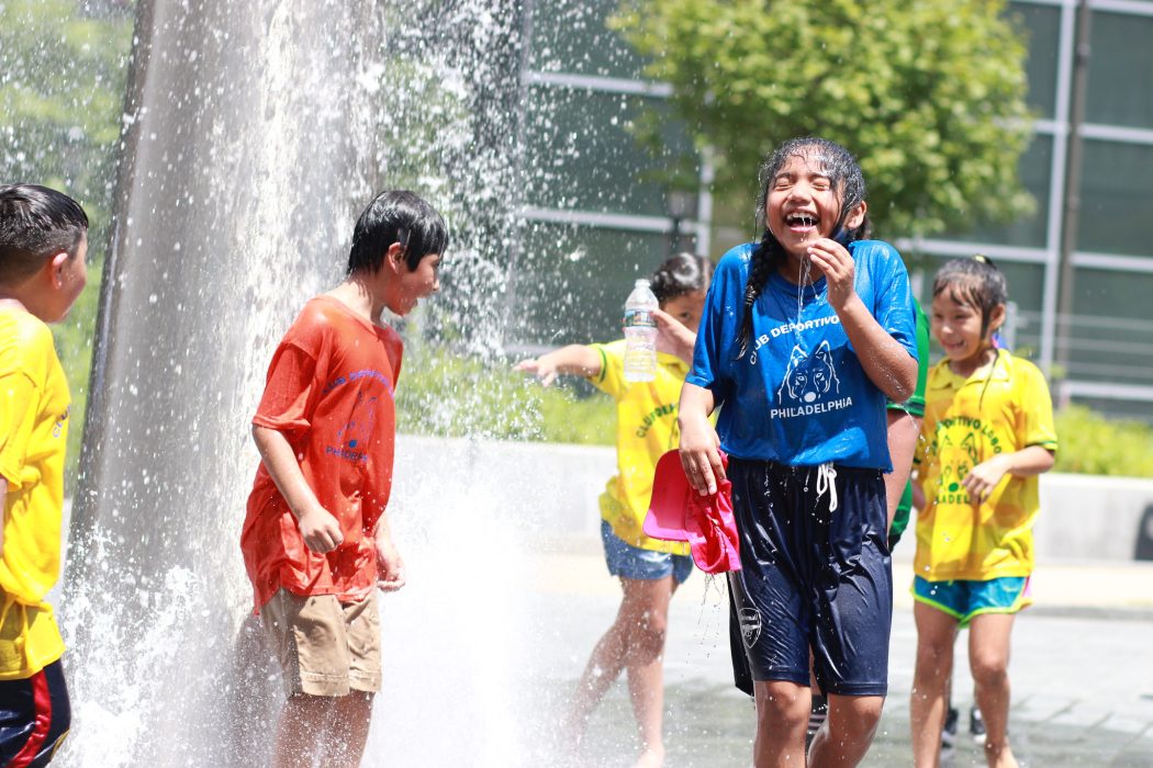 Children playing in the fountains at Dilworth Plaza