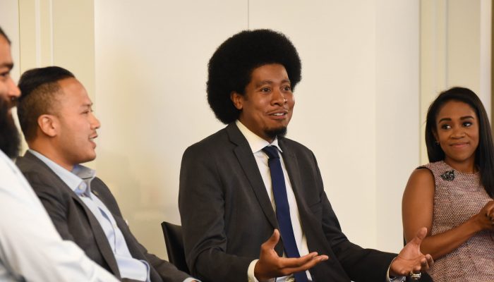 Four panel speakers seating on stage during a previous Minority Enterprise Development Week event.