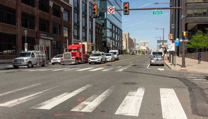 The intersection of Market and 23rd streets with vehicles waiting at a red light