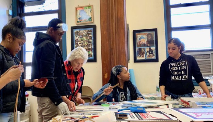 African-American high school students work on stained glass art at Kendrick Recreation Center in Philadelphia.
