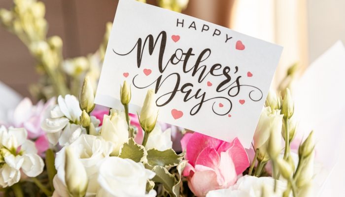 pink and white flowers with a card that reads, "Happy Mother's Day"