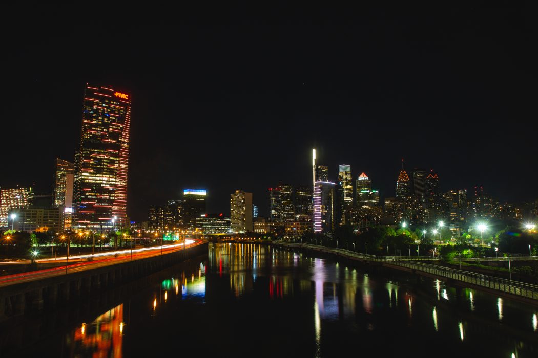 Image of the Philadelphia skyline lit up with orange lights. Orange is the color of National Gun Violence Awareness Month.