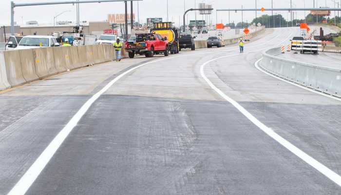 The portion of I-95 that has been reconstructed and completed. Construction equipment is visible in the background