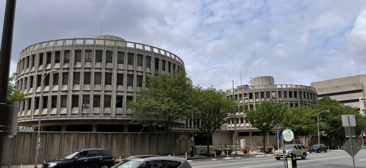 Exterior photo of the Police Administration Building, also known as the Roundhouse, on a cloudy day