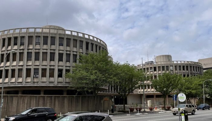 Exterior photo of the Police Administration Building, also known as the Roundhouse, on a cloudy day