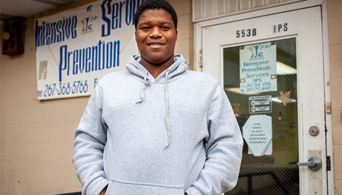 M.E. smiles for the camera outside the Intensive Prevention Services site at the Juvenile Justice Center of Philadelphia.