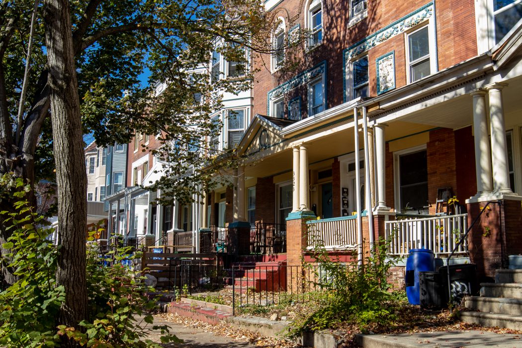 brick façade homes in West Philadelphia on a sunny day