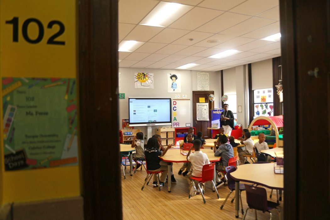 Children sitting down in a classroom
