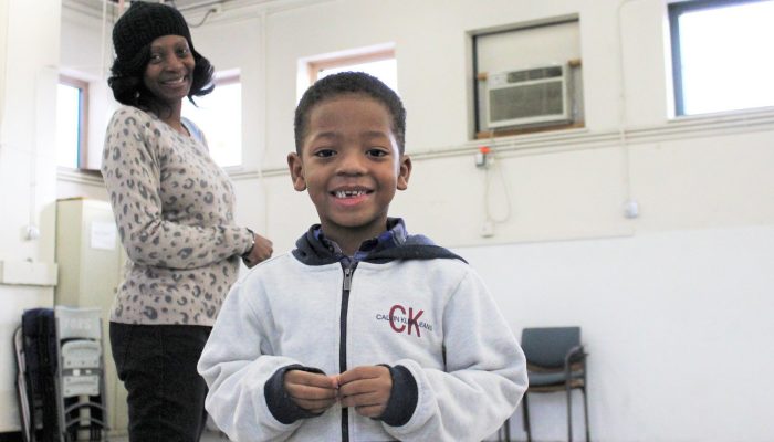 A woman and a child smile at a Philadelphia Parks & Recreation center in Philadelphia.