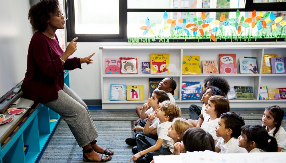 A teacher speaking to a small group of students