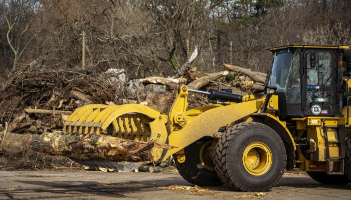 A log forwarder carries a a dead tree to the Reforestation Hub located at the Fairmount Park Organic Recycling Center.