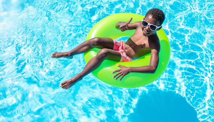 Child swimming in pool