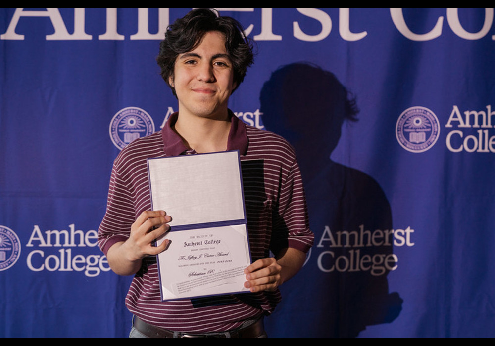 Office of Immigrant Affairs Summer Intern holding a certificate