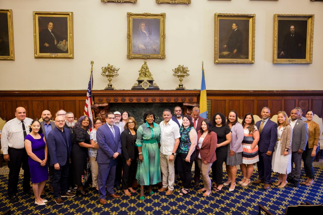 Mayor Parker and Director of Latino Engagement pose with community partners