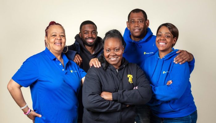 A small group of smiling CEO canvassers