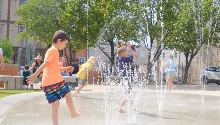 Children playing at a water feature park.