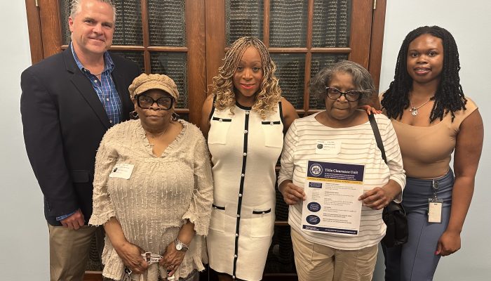 Chief Deputy Bob Stewart, Constance Neal, Councilmember Jamie Gauthier, Alfreda Wortham, and Director of the Title Clearance Unit Myasia Williams celebrating the deed transfer.