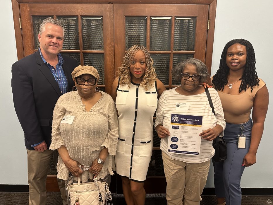 Chief Deputy Bob Stewart, Constance Neal, Councilmember Jamie Gauthier, Alfreda Wortham, and Director of the Title Clearance Unit Myasia Williams celebrating the deed transfer.