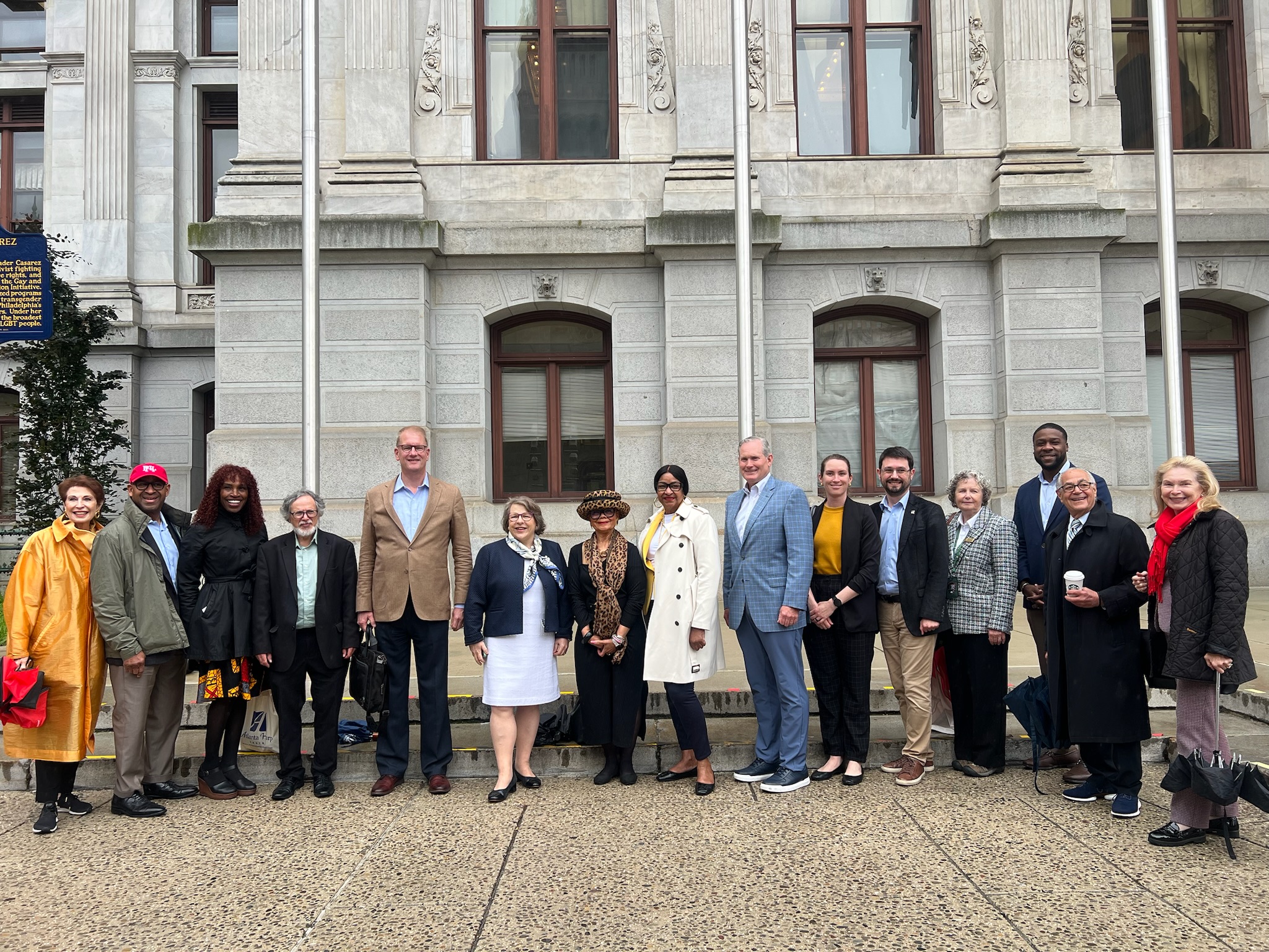 Members of Global Philadelphia pose outside City Hall where the flag raising ceremony took place.