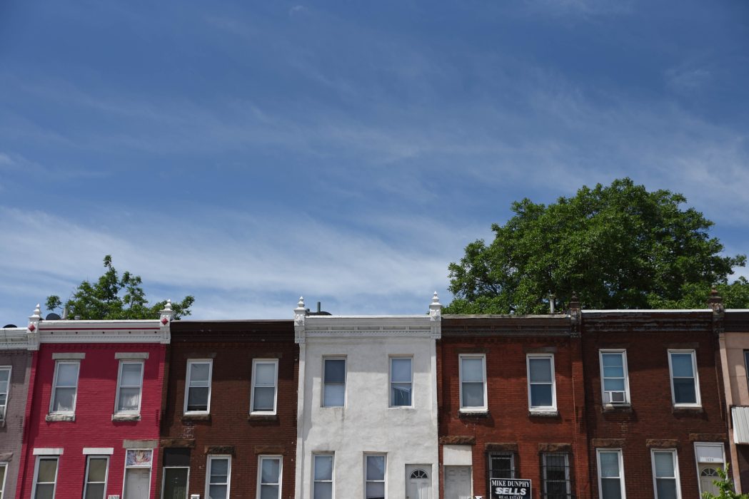 A photo of the front of rowhomes in a Philadelphia neighborhood.