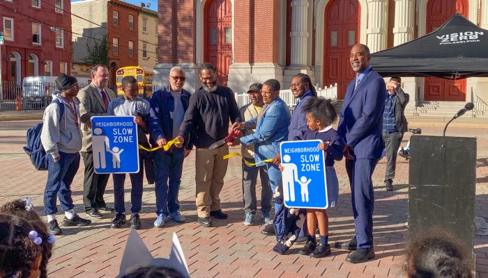 Community members cut the ribbon to the new Slow Zone