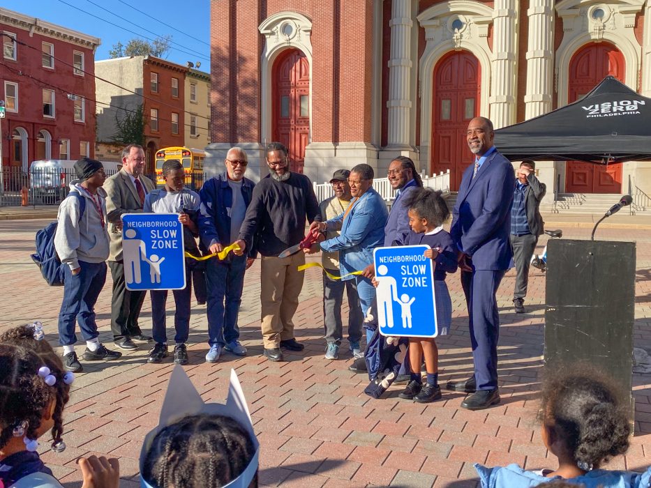 Community members cut the ribbon to the new Slow Zone