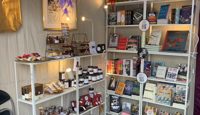 Items for sale within The Welcoming Center's booth at Christmas Village