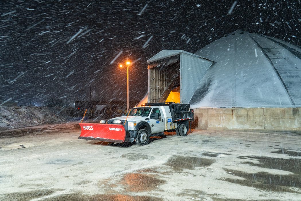 Snow Plow in front of salt dome in Philadelphia during the snow.