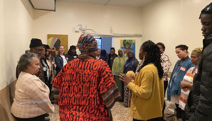 A group of people standing and talking