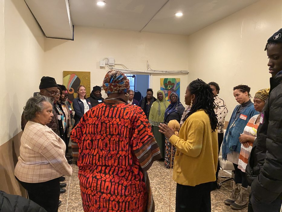 A group of people standing and talking